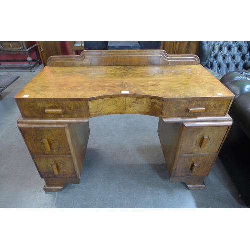 20 - An Art Deco figured walnut desk