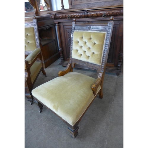 21 - A pair of Victorian Aesthetic Movement carved oak and green fabric upholstered lady's and gentleman'... 