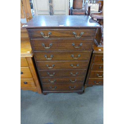 211 - An early 20th Century mahogany semainier chest of drawers