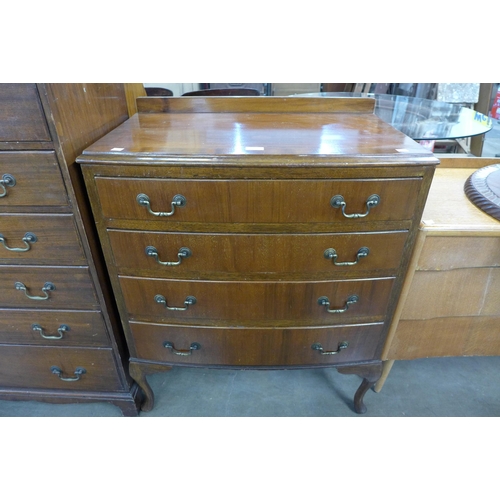 212 - A walnut bow front chest of drawers