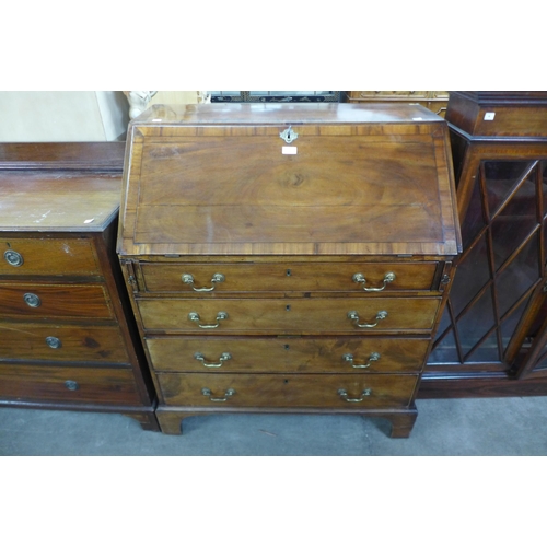 217 - A George III inlaid mahogany bureau