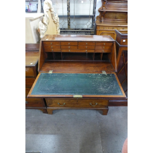 217 - A George III inlaid mahogany bureau