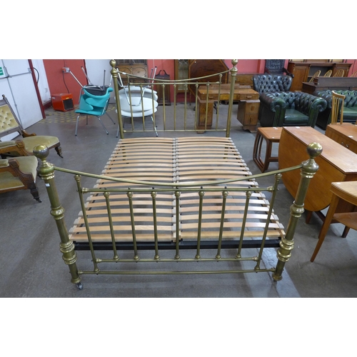 22 - A Victorian style brass King size bed