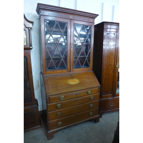 227 - A George III style inlaid mahogany bureau bookcase