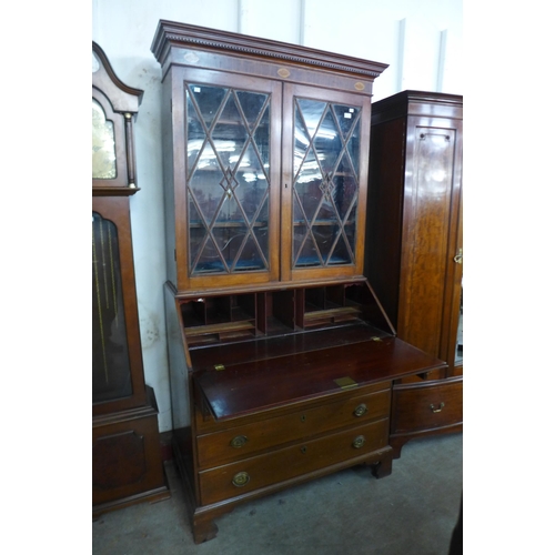 227 - A George III style inlaid mahogany bureau bookcase