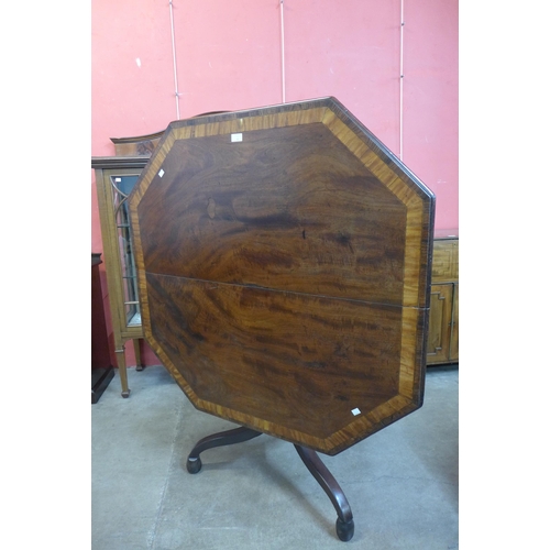 23 - A George IV mahogany octagonal tilt centre table