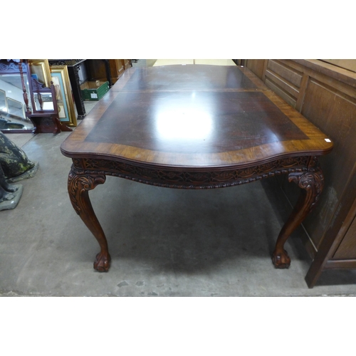 234 - A Chippendale style mahogany extending dining table