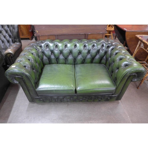 24 - A green leather Chesterfield settee