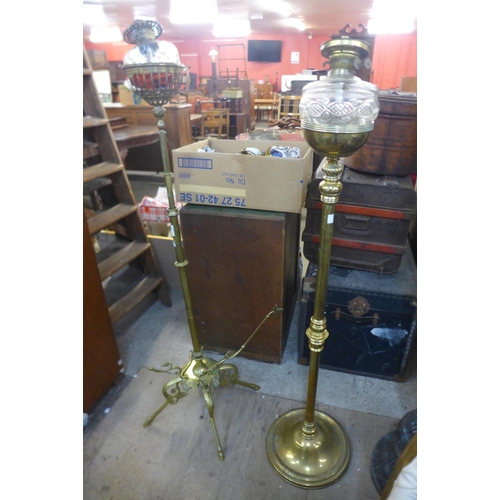 264 - Two brass floor standing oil lamps