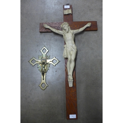 269 - A French oak and chalk effect crucifix and a brass crucifix