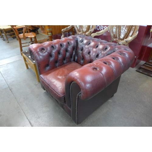 27 - An oxblood red leather Chesterfield club chair