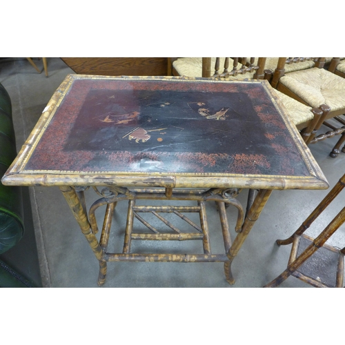 28 - A Victorian bamboo and black lacquered occasional table and a jardiniere stand