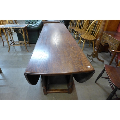 30 - A large George III style oak gateleg wake table