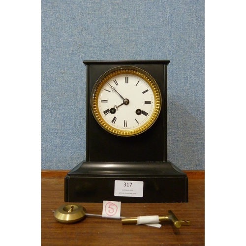 317 - A 19th Century French Belge noir mantel clock