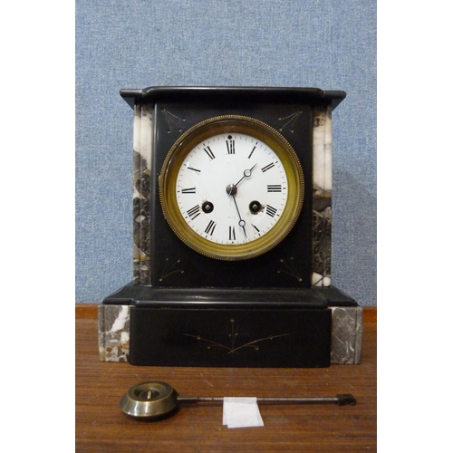 318 - A 19th Century French Belge noir mantel clock