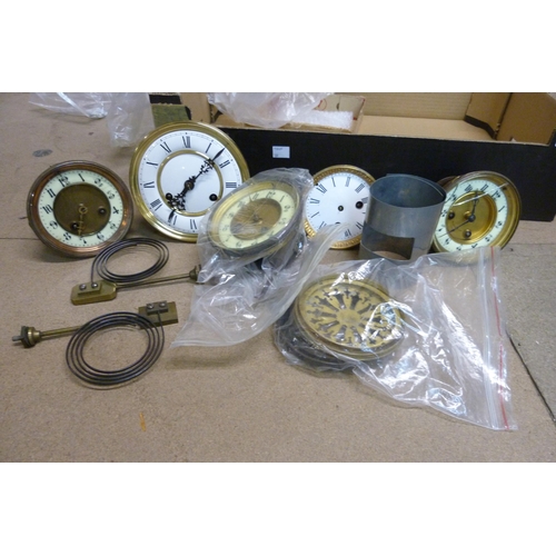 324 - A box of assorted clock parts