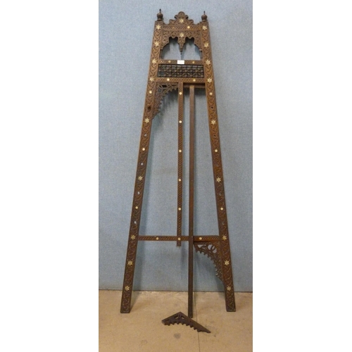 325 - A Moorish carved wood and mother of pearl inlaid easel