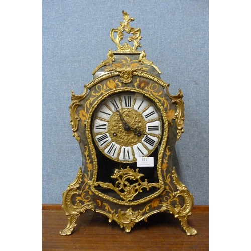 331 - A French style simulated marquetry and gilt metal bracket clock