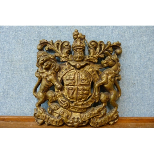 333 - A gilt cast iron wall hanging coat of arms