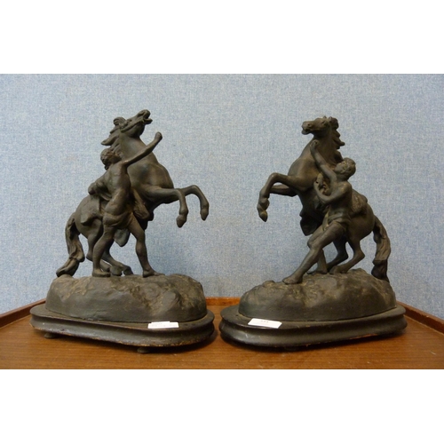 334 - A pair of French spelter Marley horses, on ebonised wooden plinths