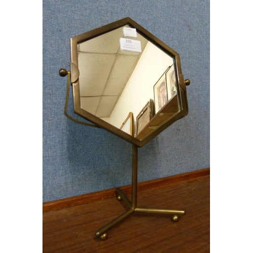 335 - An Art Deco style brass shaving mirror