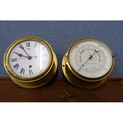 386 - A brass ships style clock and aneroid barometer