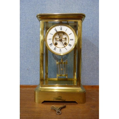 387 - A 19th Century French Japy Freres brass and glass four sided mantle clock