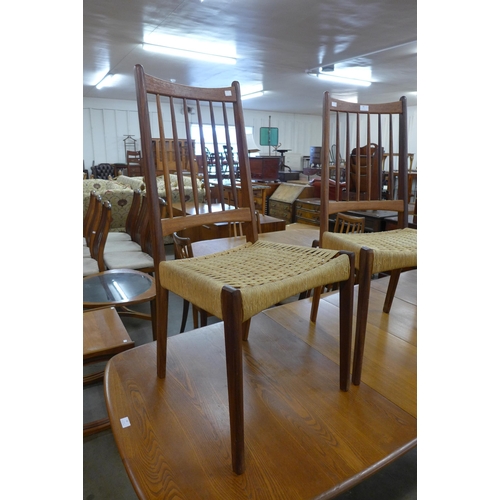 45 - A pair of Danish Mogens Kold teak and paper cord seated chairs, designed by Arne Hovmand Olsen