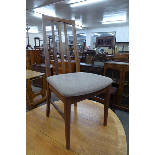 64 - A William Lawrence teak extending dining table and four chairs