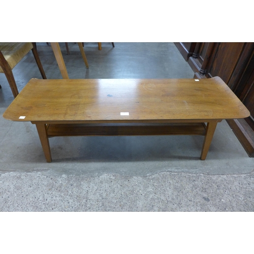 66 - A teak and bent plywood sleigh top coffee table