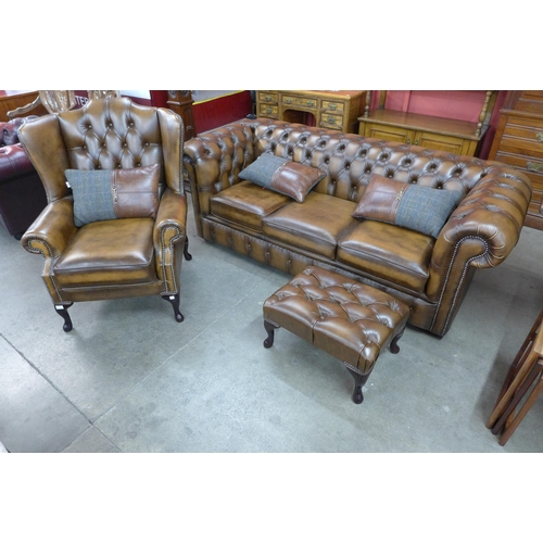 7 - A Chesterfield brown leather three piece lounge suite, comprising; sofabed settee, wingback armchair... 