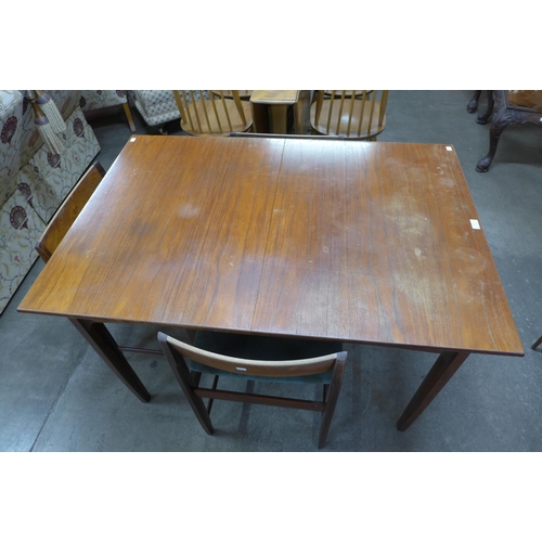 81 - A teak extending dining table and four chairs