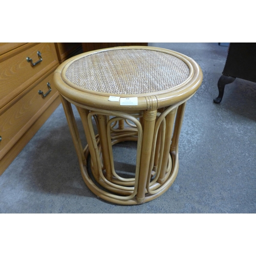 88 - A bamboo and wicker circular nest of tables