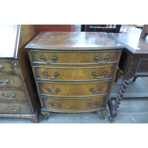 95 - A small walnut bow front chest of drawers