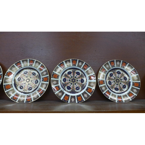 613 - Five Royal Crown Derby Imari dinner plates, 27cm, (four seconds)