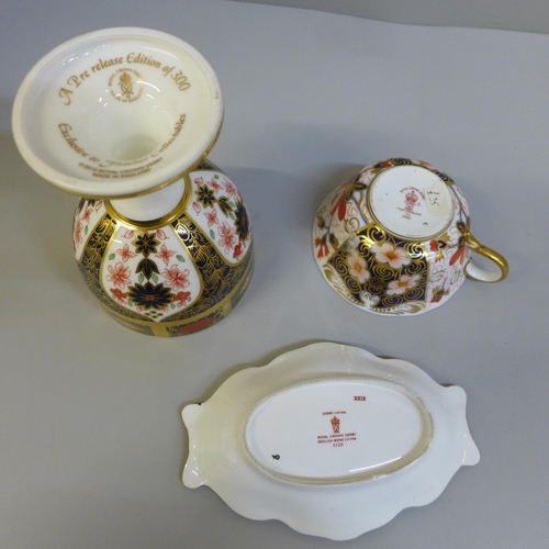 635 - Rpoyal Crown Derby; a Pre-release edition Imari goblet, 1128 Imari pin dish and an Imari cup and sau... 