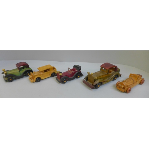 678 - Five wooden model cars