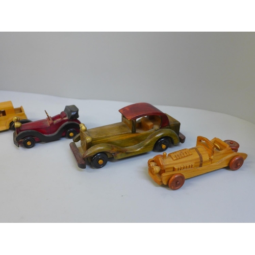 678 - Five wooden model cars