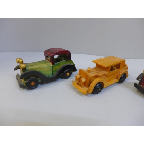 678 - Five wooden model cars