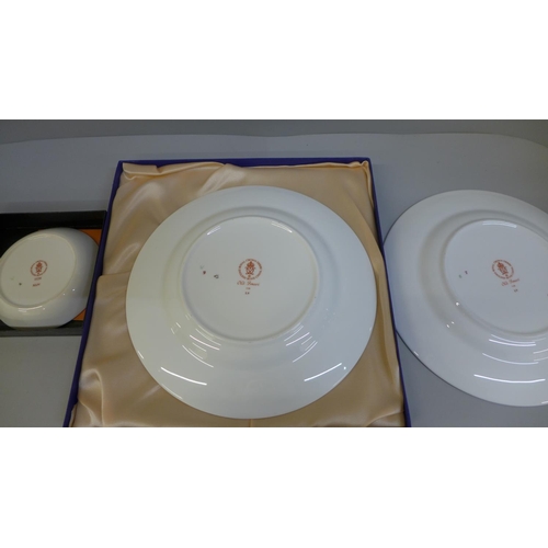 683 - Two Royal Crown Derby Imari plates, one boxed, both 21.5cm (seconds) and a small dish, boxed