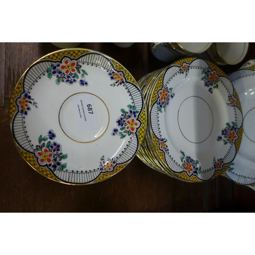 687 - A Wetley china Art Deco enamelled decoration tea set, some a/f, 12 tea plates, saucers, 7 cups, milk... 