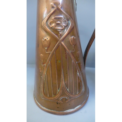 688 - Three Arts and Crafts/Art Nouveau jugs; two copper and one gilt brass