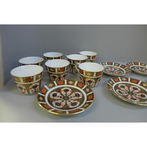 691 - Seven Royal Crown Derby Imari tea cups and saucers, some seconds