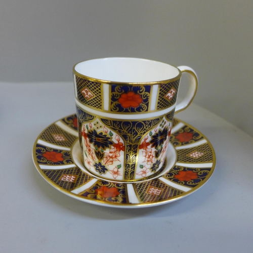 694 - A Royal Crown Derby Imari coffee can and saucer, (second) tea cup and saucer and two side plates, (p... 