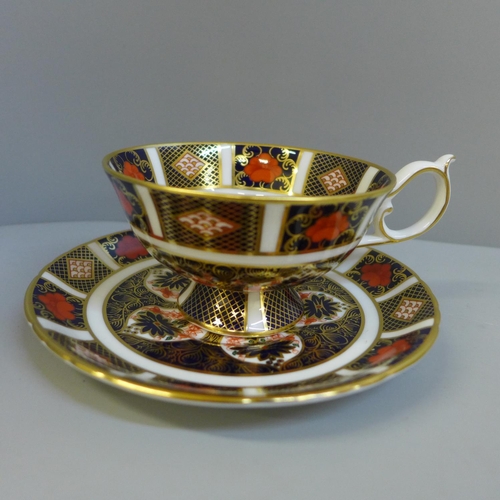 694 - A Royal Crown Derby Imari coffee can and saucer, (second) tea cup and saucer and two side plates, (p... 