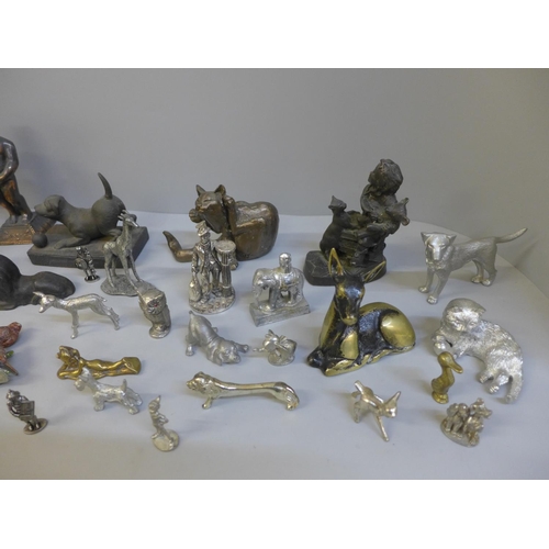 698 - A collection of metal animals including a bronze lion