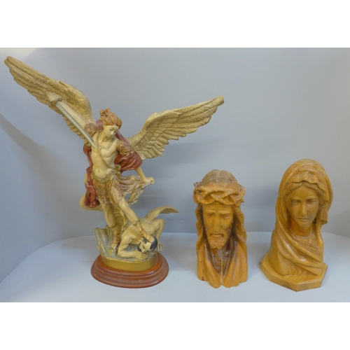 704 - Two carved busts, Jesus Christ and Mary and a figure of St Michael defeating Satan