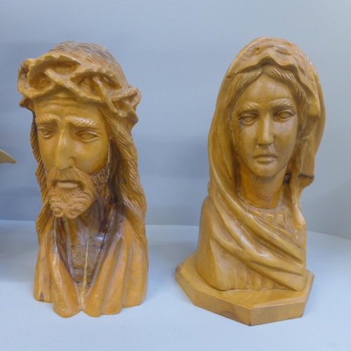 704 - Two carved busts, Jesus Christ and Mary and a figure of St Michael defeating Satan