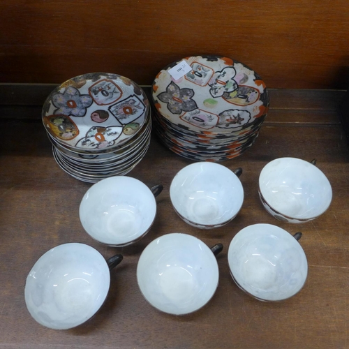 705 - A Chinese tea set with six cups, twelve saucers and eight tea plates