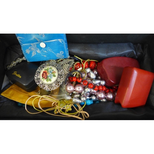 706 - A box of costume jewellery